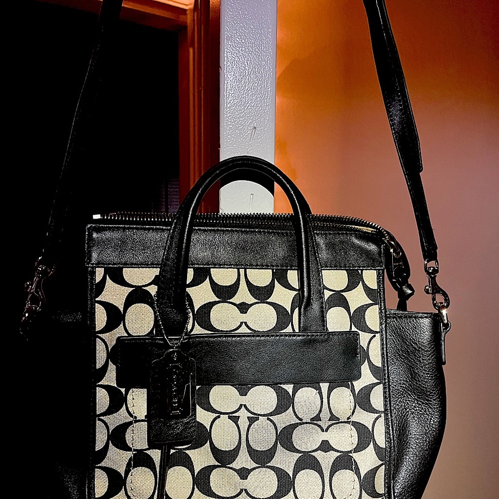 Gently used authentic Coach clutch handbag, originally priced at $190.